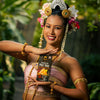 Woman in traditional attire holding a 'SIAM' Pad Thai noodle kit with a natural background